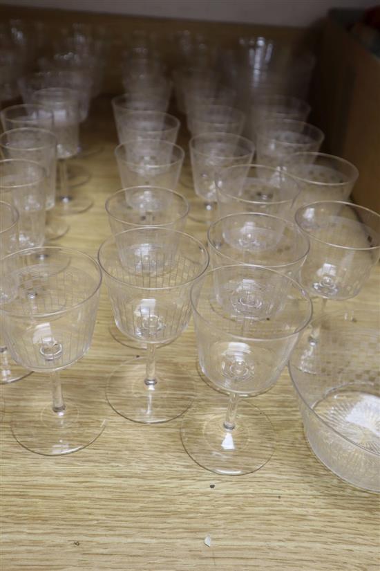 A suite of Edwardian etched drinking glasses and finger bowls, each decorated with a chequer design